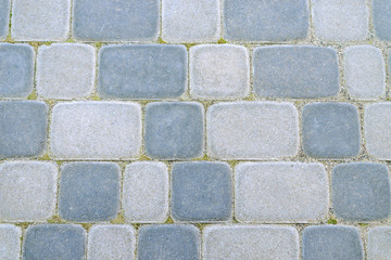 Pavement in the city. Stone tile of light and dark stone. Abstract background.