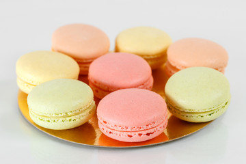 Fototapeta na wymiar Sweet french macaroons or macaron on white background, Dessert. Pink and lemon