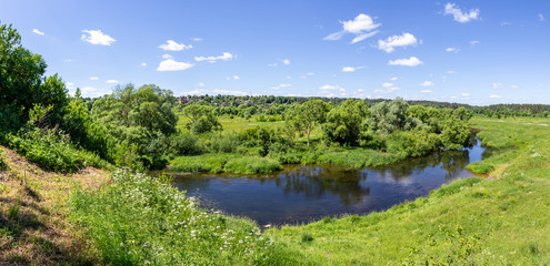 Beautiful landscape of Central Russian hills, view from the hill to the river and forest