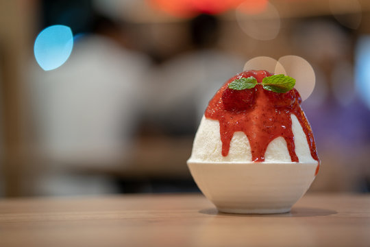 Korean shaved ice dessert with sweet toppings, Strawberry Bingsoo or Bingsu with soft focus