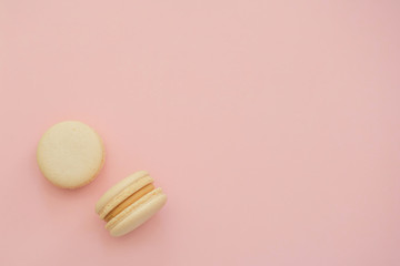 macaroons on a pink background. copy space. 