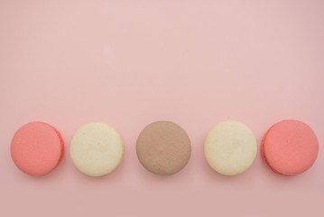 macaroons on a pink background. copy space. 