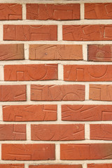 Fototapeta na wymiar textured wall of brick with ornament