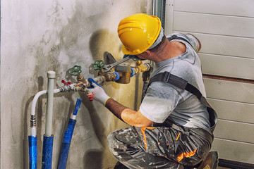 plumbing services, plumber at work
