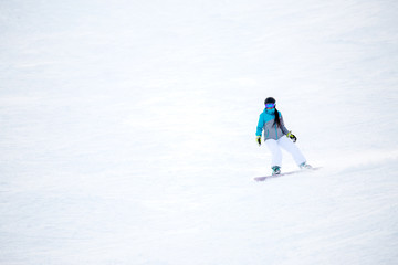 Fototapeta na wymiar Photo of female athlete riding snowboard
