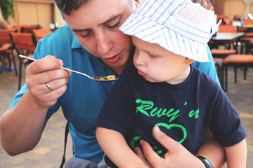 Father Feeding Baby son