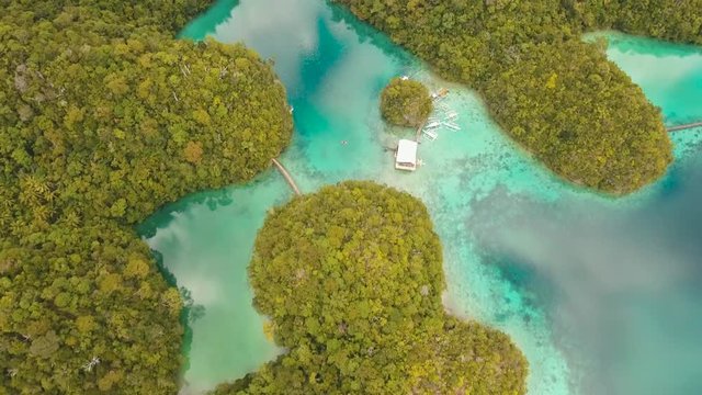aerial footage cove with blue lagoon between tropical islands. Tropical landscape bay azure water lagoon Sugba philippines, siargao Travel concept