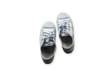 old sneakers on basically the concrete.