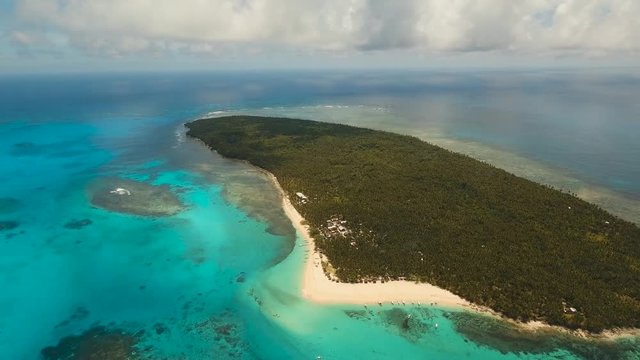 aerial footage tropical island with beach and palm trees lagoon with turquoise water Sea tropical landscape Daco island, Philippines, Siargao. Travel concept Aerial video