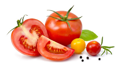Delicious fresh tomatoes and herbs in a wooden bowl. Close up shot, isolated on white background. Gourmet food or healthy eating.
