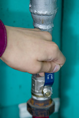 Hand with a crane lever with indicators open and closed