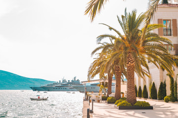 panoramic view of resort city at seaside with big white ship in port