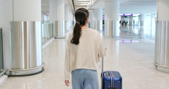 Woman walking into the airport