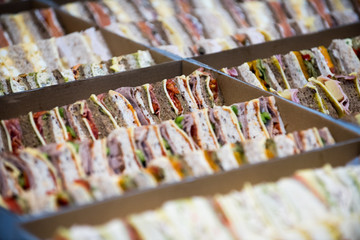 sandwiches cut in to triangles served as catering at an event