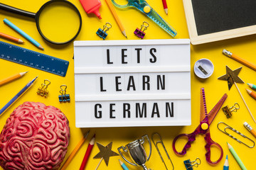 Lets learn german lightbox message on a bright yellow background