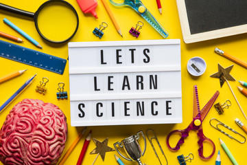Lets learn science lightbox message on a bright yellow background