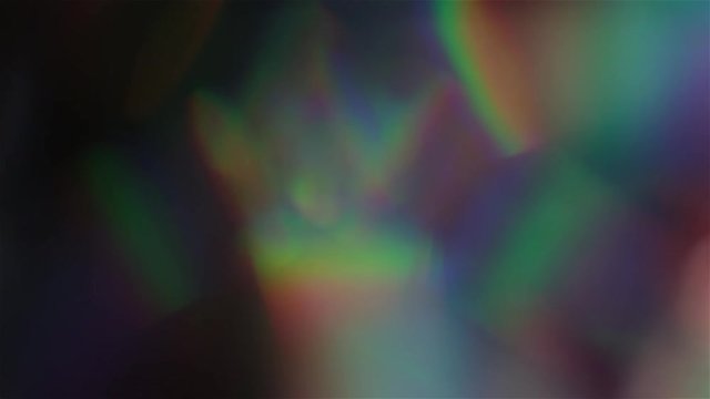 Futuristic bokeh. Holographic iridescent foil. Multicolored shiny surface and shining abstract background.