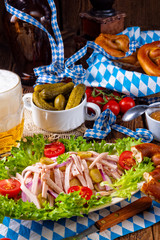 delicious bavarian sausage salad with onion and cucumbers