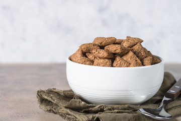 Chocolate pillows in white bowl. 