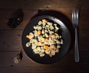 dish of beans cooked at home on wood