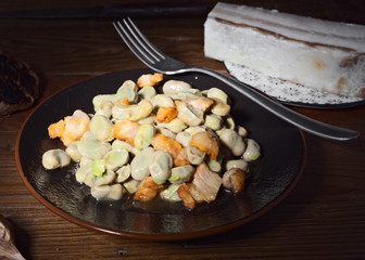 dish of beans cooked at home on wood