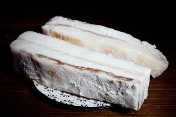 pieces of Iberian bacon on wooden board