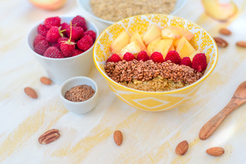 gorgeous healthy breakfast, oatmeal porridge with flax seeds, raspberries and nuts, concept healthy food
