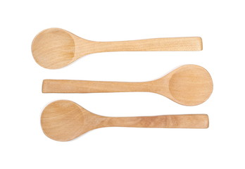 Empty wooden spoons isolated on white background, top view