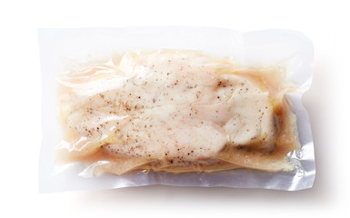 Chicken breast vacuum sealed isolated on white, from above