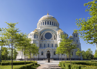 Sea Cathedral of St. Nicholas with a monument to the famous Russian admiral Fyodor Ushakov in the foreground in Kronstadt, St. Petersburg, Russia