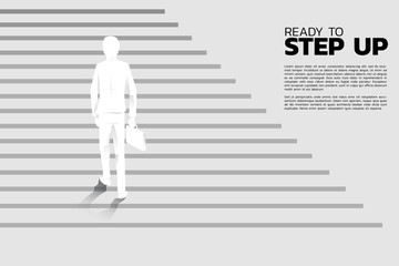 Silhouette of businessman with briefcase step up on stair. Concept of people ready to up level of career and business.