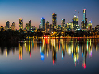 The stunning Melbourne skyline reflected in Albert Park Lake.