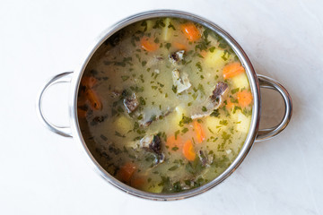 Homemade Meat Stew Beef Rip Soup with Vegetables in Pan.