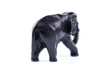 Fototapeta na wymiar Black elephant like wooden carving with white ivory. Stand on white background, Isolated, Art Model Thai Crafts, For decoration Like in the spa.