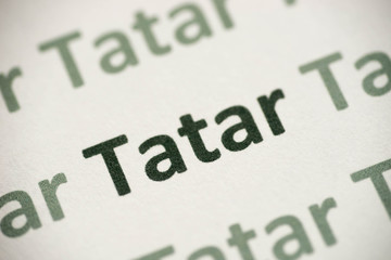 word Tatar  language printed on paper macro