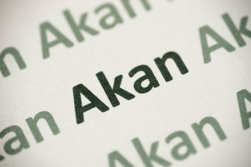 word Akan language printed on paper macro