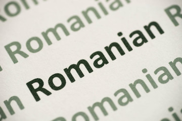 Fototapeta premium word Romanish language printed on paper macro