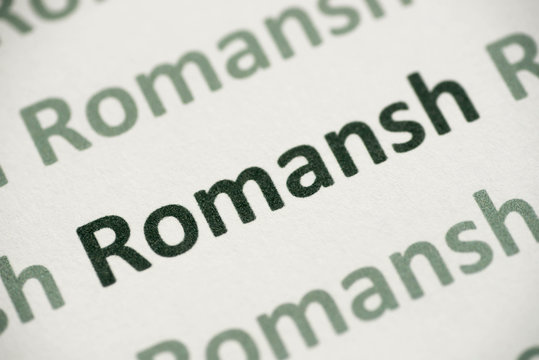 word Romansh language printed on paper macro