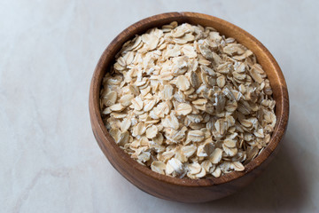 Plain Raw Oatmeal in Wooden Bowl.