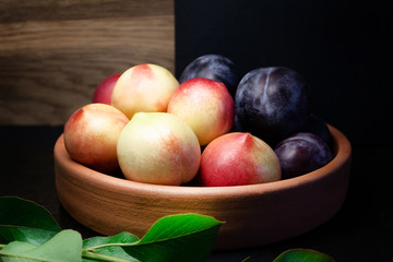 pulms and nectarines on plate