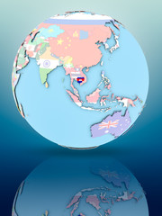 Cambodia on political globe with flags