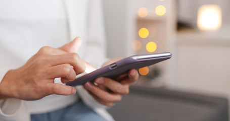 Woman use of mobile phone at home