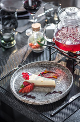 Cheesecake with berries and red fruit tea