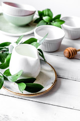 ceramic tableware with flowers on white background