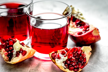 pomegranate juice with seed on stone table background © 279photo