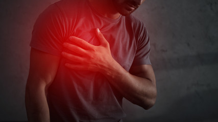 cropped view of man having heart attack with red painful point