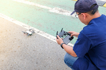Young man operating of flying drone