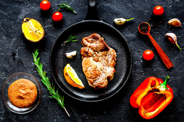 concept cooked steak on dark background top view