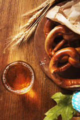 Salted pretzels for Oktoberfest on old  wooden board  with free text space.