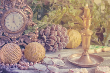 New Year's decor. Retro clock with old fashioned christmas tree decorations.